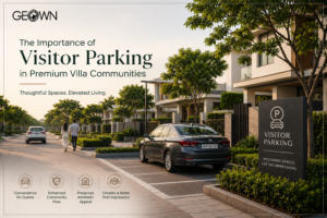 Cars parked at the gate to the villas and a quite road