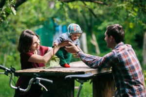 adorable-baby-with-parents-park