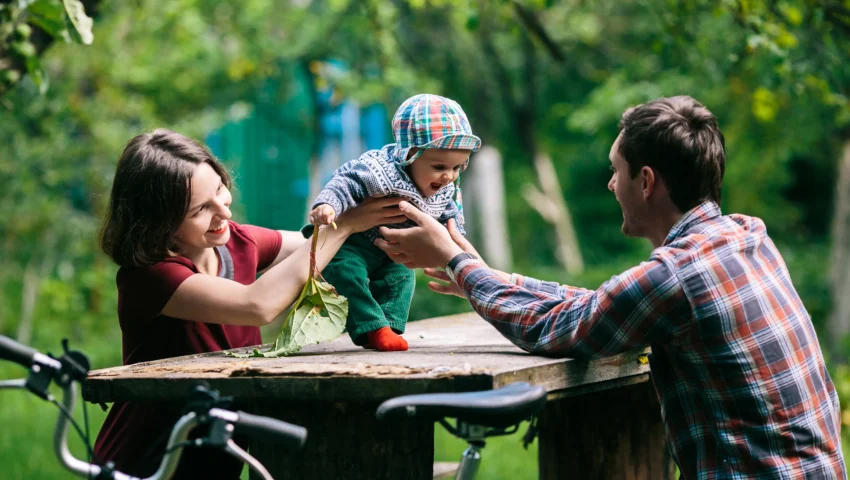 adorable-baby-with-parents-park